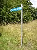 Roadsign pointing to the inscription.