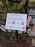 A plaque on its holder. Village of Galičnik, North Macedonia.