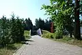 The alley leading from the Smolensk–Vitebsk highway to the main entrance to the Memorial Complex