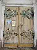 The historical hammer-work doors, crafted by a local master