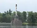Side view shows an entrance leading into the base pedestal.[1]