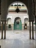 A view of one of the ṣoḥoon framed by an archway.