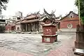 Exterior courtyard with a small tower for burning joss paper