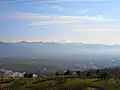 Panorama view of Yamanashi city and Kōfu Basin, from hill of Fuefuki River Fruit Park