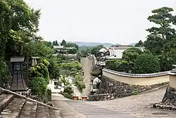 Sloped streets with masonry walls.