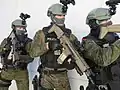 Three Catalan GEI operatives armed with SCAR-Ls