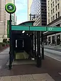 Headhouse and bus stop on the northeast corner of 13th & Market streets (Pre-Metro Era)