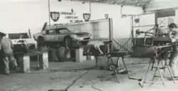 Neri and Bonacini workshop in September 1963. An ASA 1000 GTC is visible on the lift at center of image