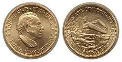 A gold medallion depicting a man and building