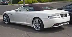 Rear three-quarters view of a white Virage Volante convertible