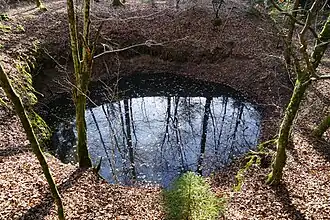 Drowned funnel-shaped hole, remnant of the de-la-Croix shaft