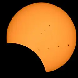 North Cascades National Park, Washington. The ISS is visible as it transits the Sun during the eclipse (4 frame composite image).
