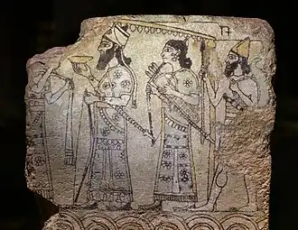 A glazed tile depicting a king and attendants, 9th century BC