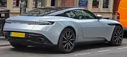 Rear three-quarters view of a white coupe