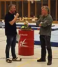 Honoring of the former by the current competition director[1]
