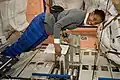 Stephanie Wilson with technical blueprints in Node 1