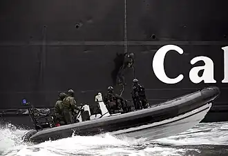 Royal Marines from 43 Commando Fleet Protection Group conducting an ‘Underway Boarding Exercise’ in conjunction with a local ferry, 2015.