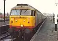 A Class 47 (no. 47373) in revised Railfreight red stripe livery