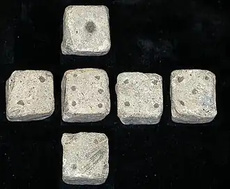 Composite image of all sides of a 12&nbsp;mm (1⁄2&nbsp;in) Roman die, found in Leicestershire, England