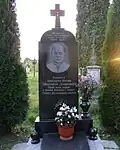 A monument to priest Michael Datsyshyn in the village Duliby.