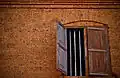 The red stone wall and a window