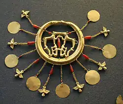 Room 12 – A gold earring from the Aegina Treasure, Greece, 1700–1500 BC