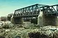 Larger bridge built in the 1930s next to the original one visible behind it
