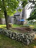 Archaeological dig adjacent to house