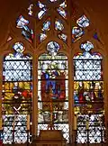 The Stained glass window: Virgin and child with donors