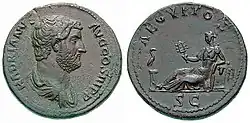 Hadrian coin celebrating Aegyptus Province, struck c. 135. In the obverse, Egypt is personified as a reclining woman holding the sistrum of Hathor. Her left elbow rests on a basket of grain, while an ibis stands on the column at her feet.