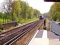 A train heads south from Ash Vale station towards Aldershot in April 2006.