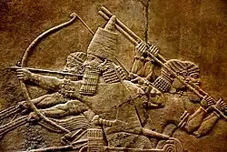 Image 327th-century BC relief depicting Ashurbanipal (r. 669–631 BC) and three royal attendants in a chariot (from Culture of Iraq)
