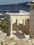 Ancient Greek portico with Ionic columns of the Temple of Athena Nike (Athens, Greece)