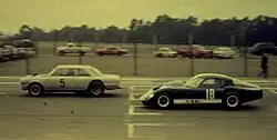 Atilio Viale in his Baufer-Ford prototype (number 18) chasing Héctor Luis Gradassi's Torino 380w (number 5) during the "VII Premio de TC Autódromo de Buenos Aires" sixteenth round of the 1967 Turismo Carretera season.