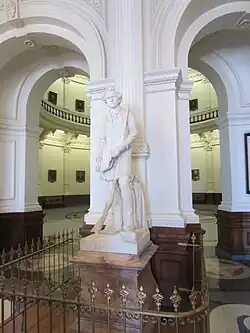 Marble statue of Stephen F. Austin on a stone pedestal