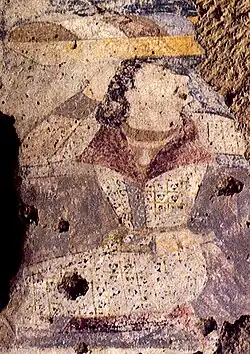 Devotee in double-lapel caftan, left wall of the niche of the Western Buddha.[40][41] He has also been described as a Hephthalite.[42]
