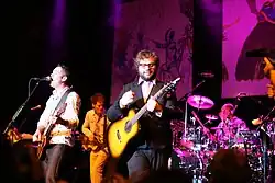 The band onstage, with Page playing guitar in the center