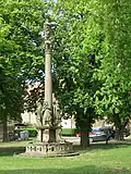 Baroque Marian column in front of the main facade depicting the Coronation of Mary