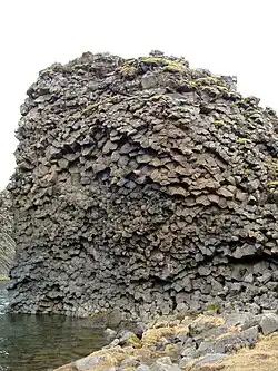 Some of the basalt columns surrounding the basin of Hjálparfoss.