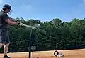 Baseball bat uses a charge to launch a baseball