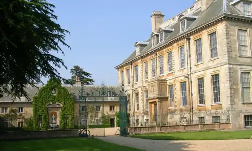 West façade (at right) and the stables (left), separated by a courtyard.