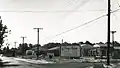 Old Harford Road at King's Ridge Road, Parkville, Baltimore County, MD, looking south, showing partial widening of Old Harford Road during construction of King's Ridge subdivision; Sep. 1956