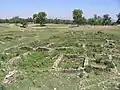 Bhir Mound, houses (center) and main street (left)