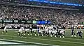 Jets QB Aaron Rodgers about to take a snap against the Bills in 2023, shortly before his Achilles injury