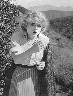Black and white photograph of a woman in Western attire