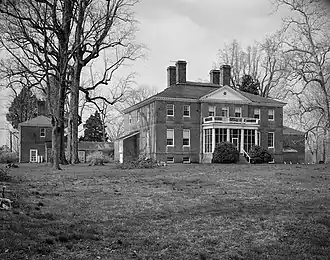 Large, two-storey home with four brick chimneys