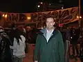 Man stood in front of banner
