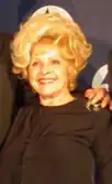 Lee smiling towards her right