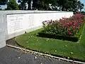 Retaining wall with the inscribed names of the missing.