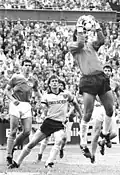 Gütschow (centre) watches a shot being saved by Henryk Lihsa shot saved during Dynamo Dresden's 5–0 win over 1. FC Union Berlin in 1989